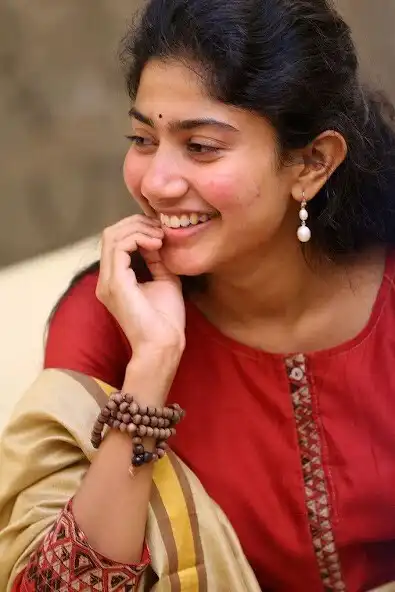 Play Latest Sai Pallavi Wallpapers HD as an online game Latest Sai Pallavi Wallpapers HD with UptoPlay