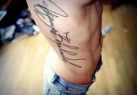 Play lettering tattoo